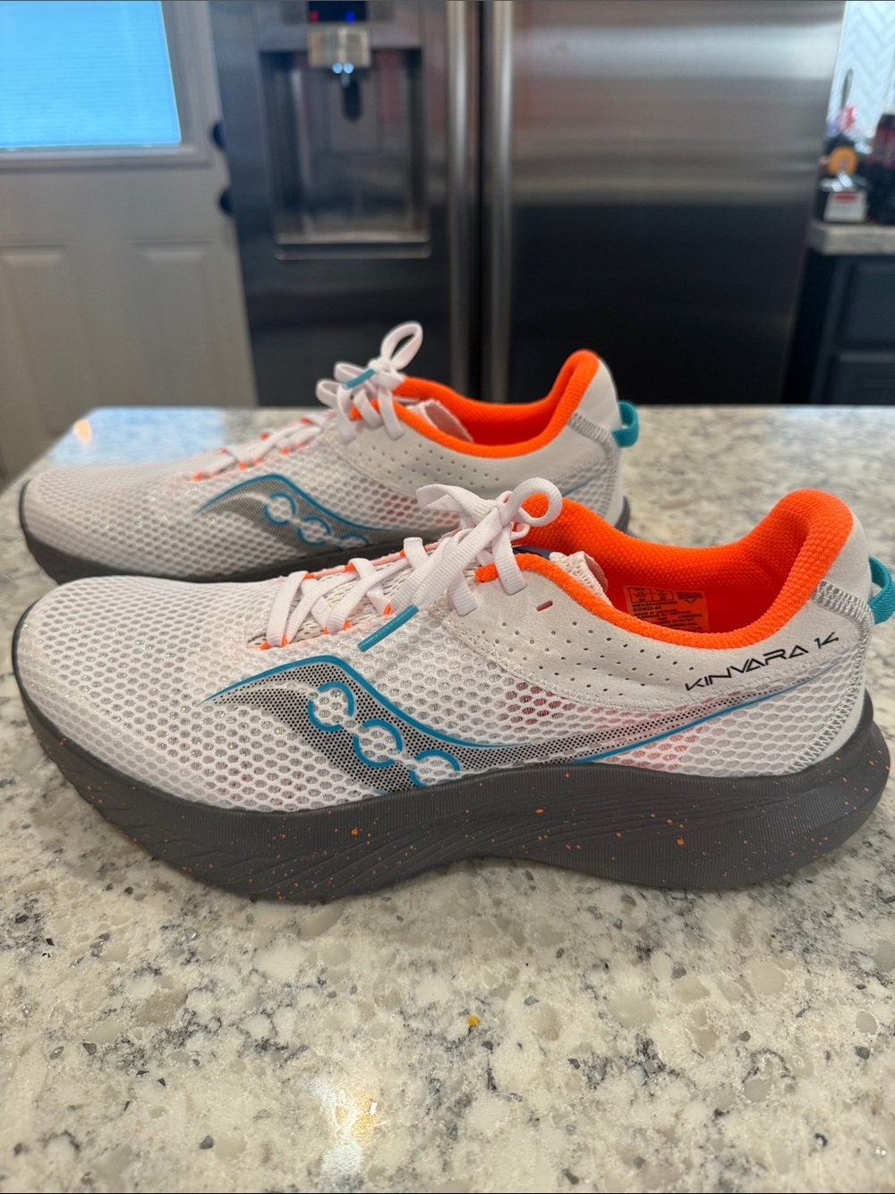 Saucony Mens Kinvara 14 Running Shoe in White with Orange & Teal Accents